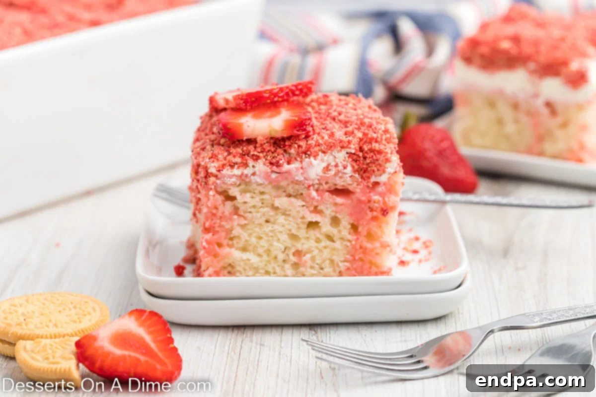 Cake Mix Magic: Easy Poke Cake Creations 2 Slice of strawberry poke cake sliced on a white plate.