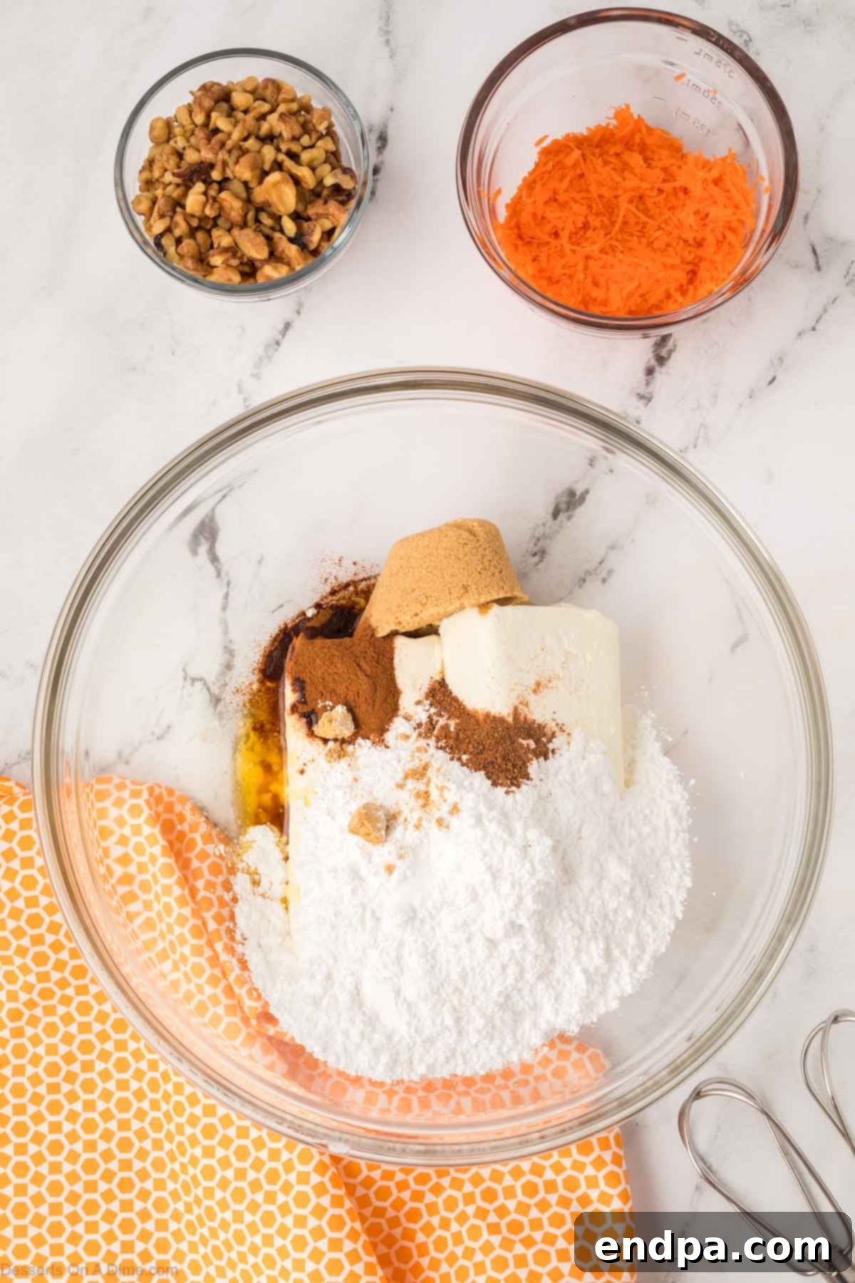 Carrot Cake Delight Dip 5 Cream cheese, brown sugar, cinnamon, and melted butter blended in a bowl.