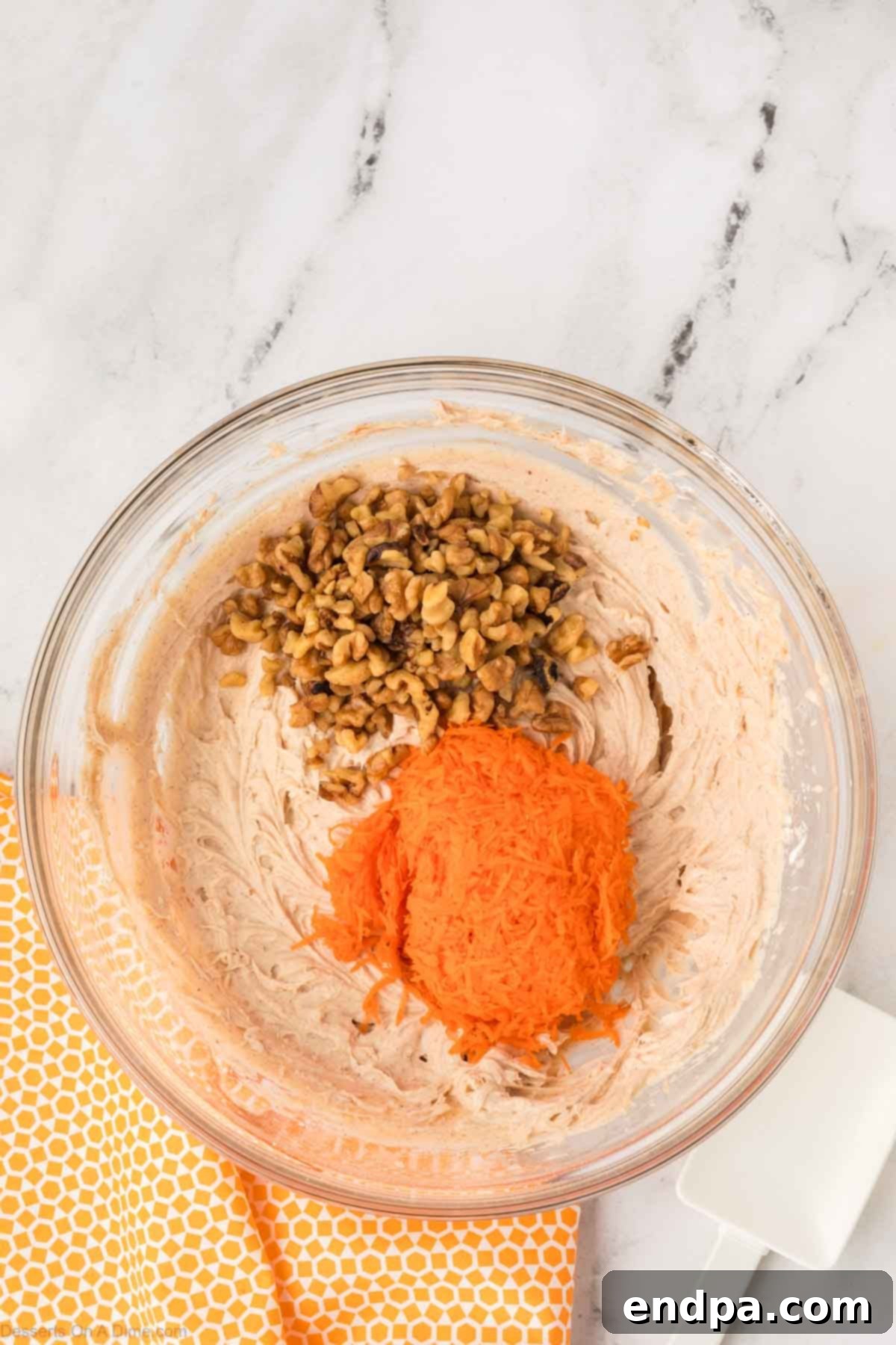 Carrot Cake Delight Dip 6 Adding carrots and nuts to the creamy mixture.