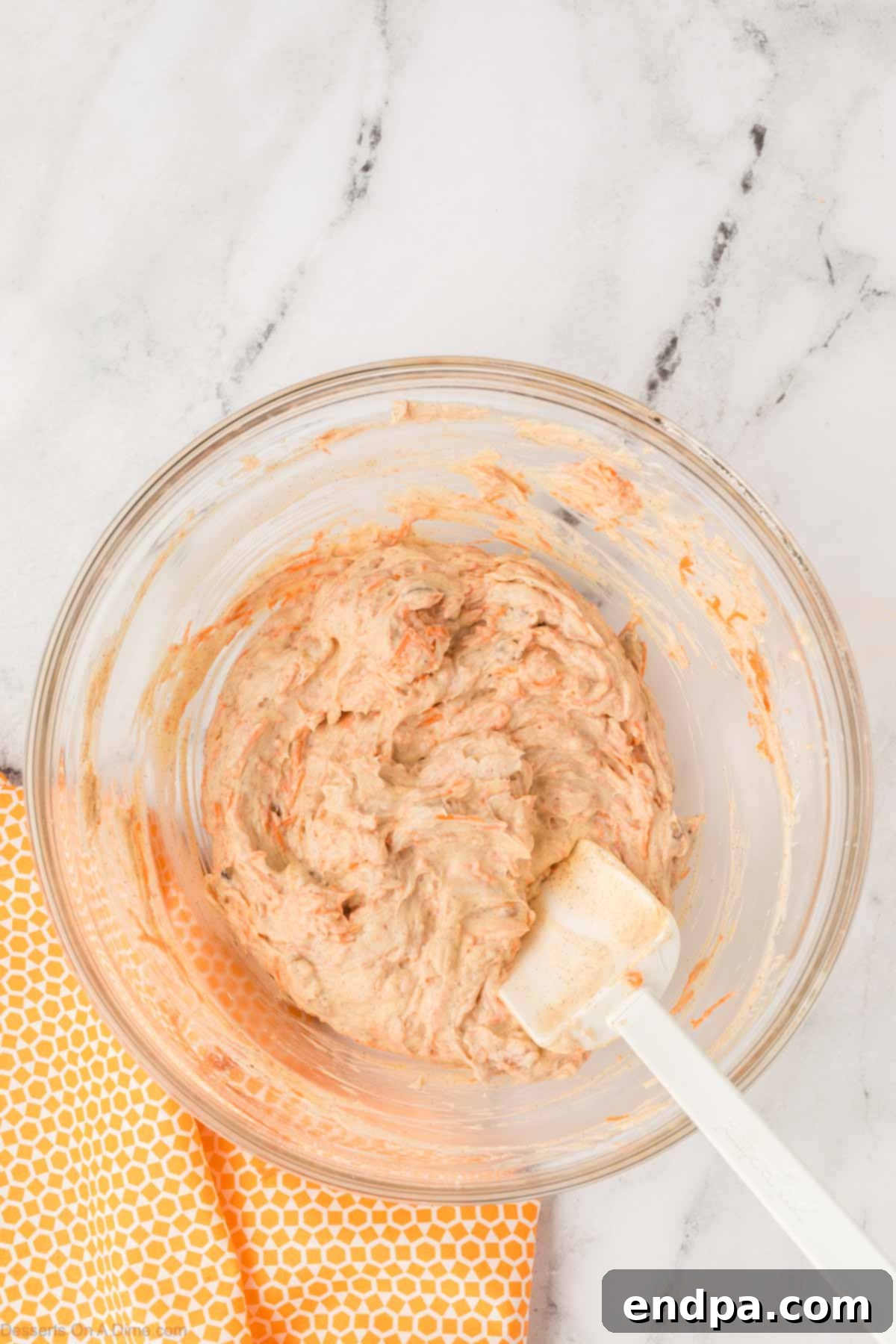 Carrot Cake Delight Dip 7 Folding the mixture until well blended.