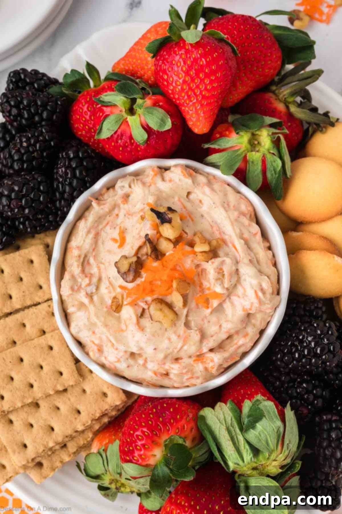 Carrot Cake Delight Dip 8 Carrot Cake Dip surrounded by a variety of delicious dippers.