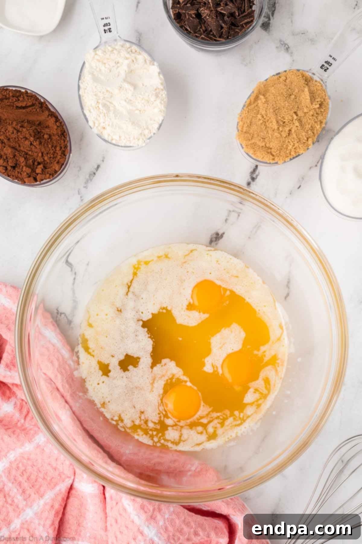 Cadbury Egg Brownie Bliss 5 Melted butter, eggs and vanilla in a mixing bowl