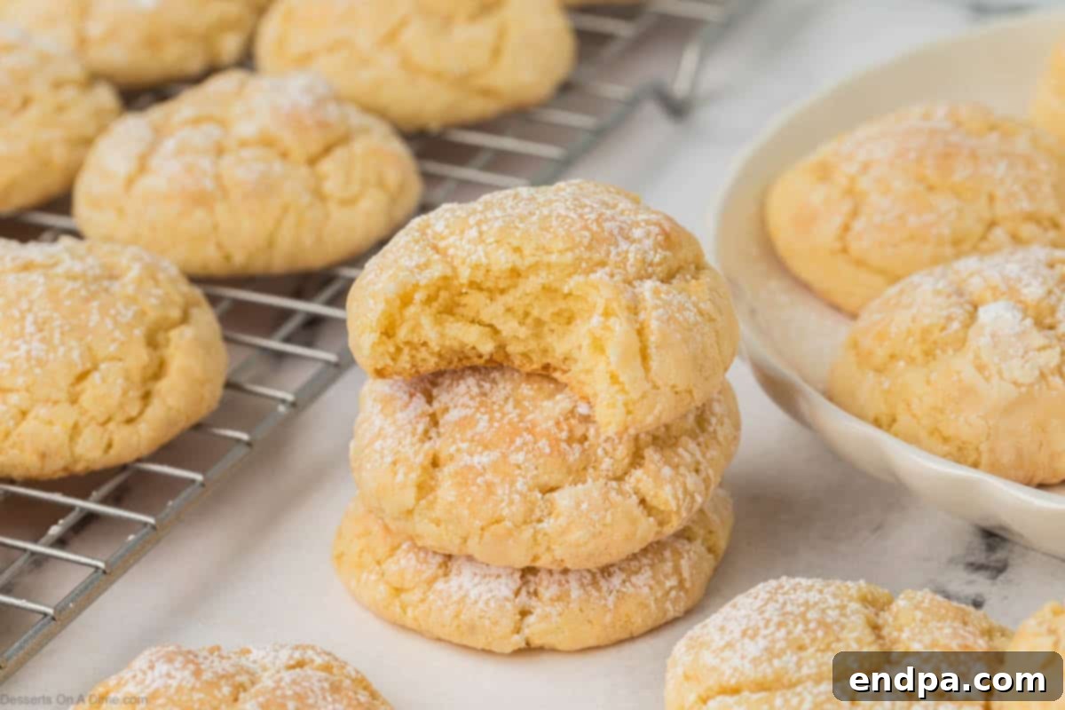 Cake Mix Butter Cookies: Ooey Gooey Goodness 2 Delicious Ooey Gooey Butter Cookies stacked high.