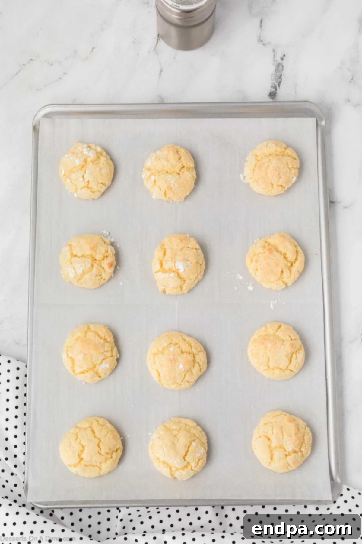 Cake Mix Butter Cookies: Ooey Gooey Goodness 10 Cookies cooling on baking sheet.