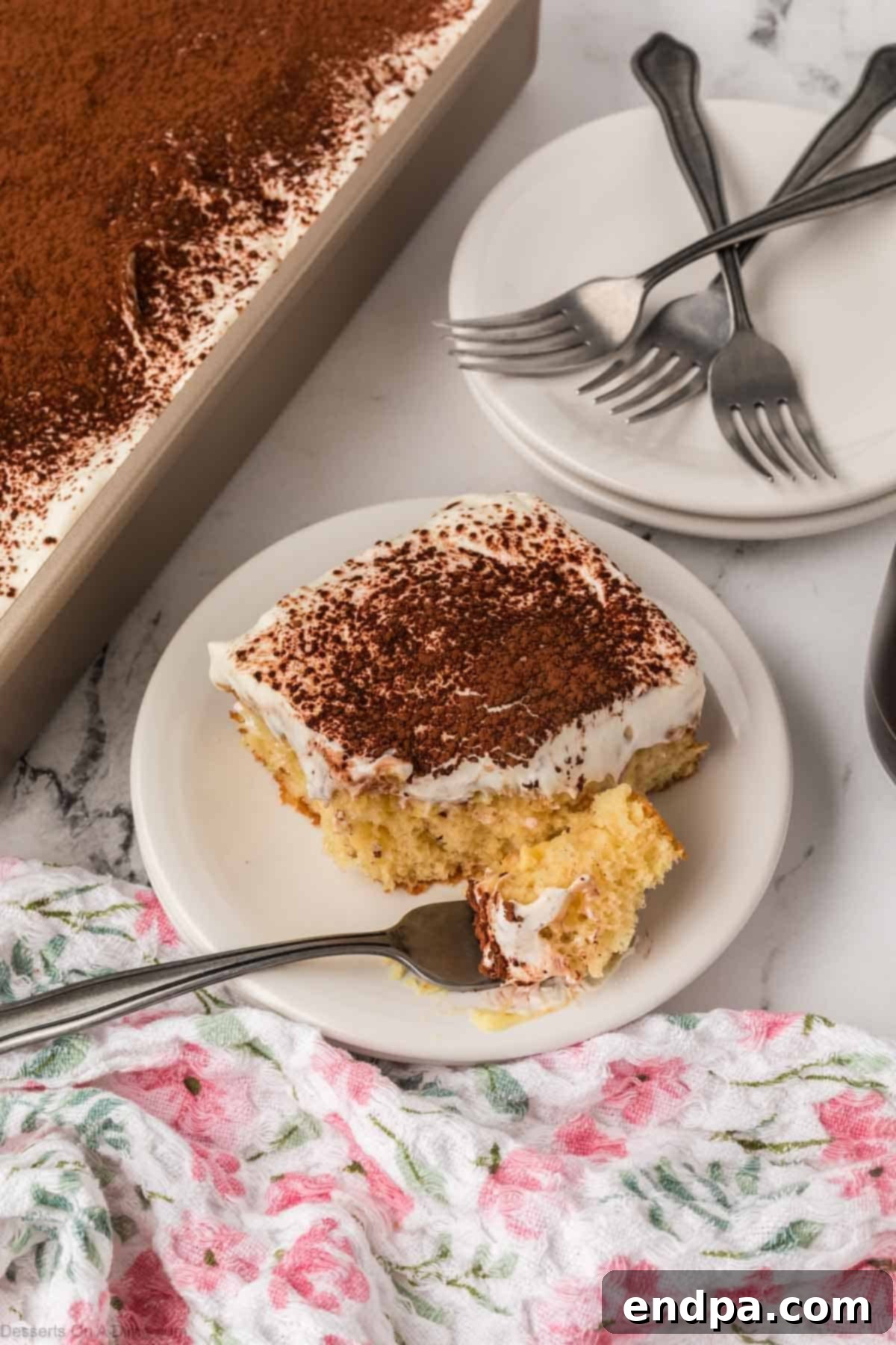 Slice of Tiramisu Poke Cake