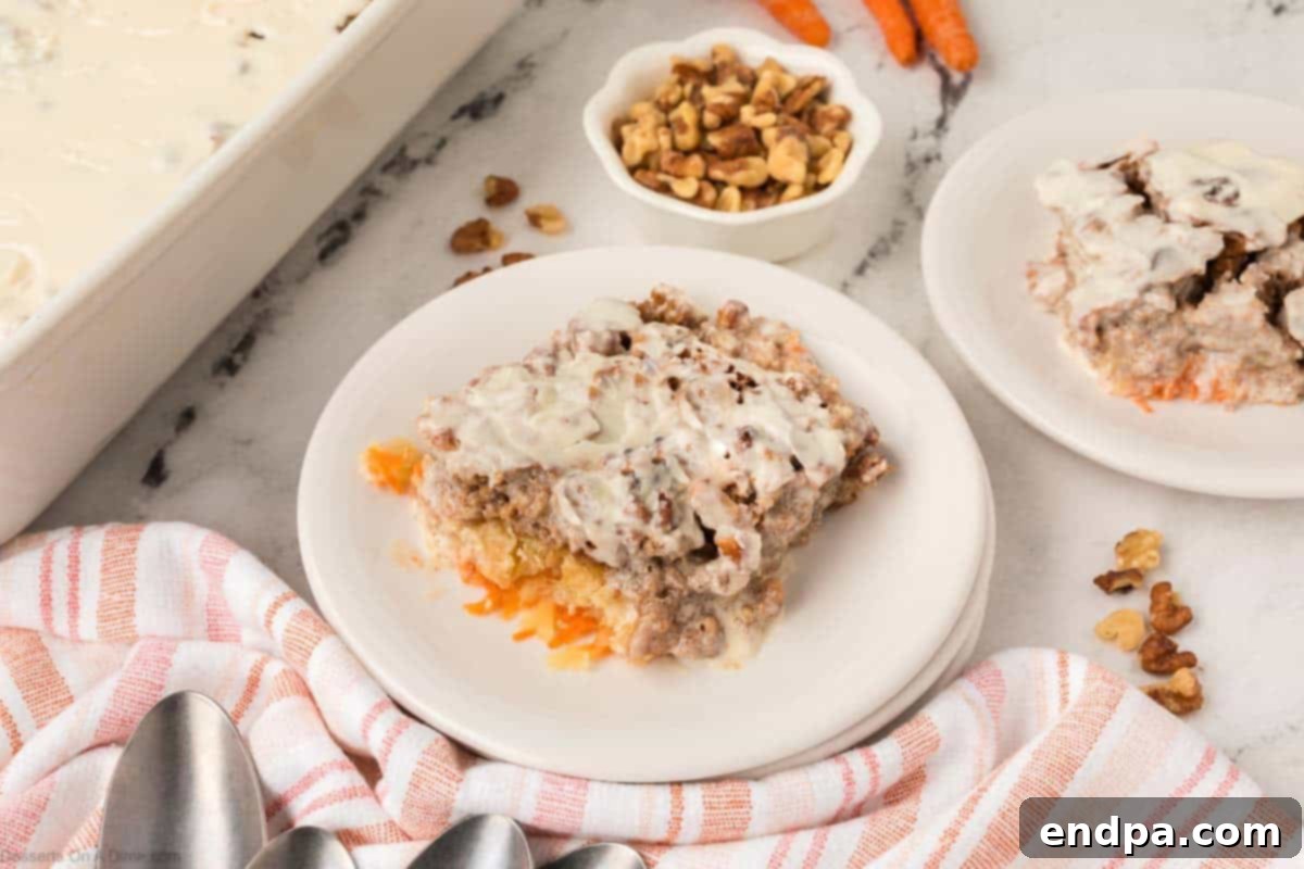 Carrot Cake Dump Cake slices on white plates, showcasing its moist texture.