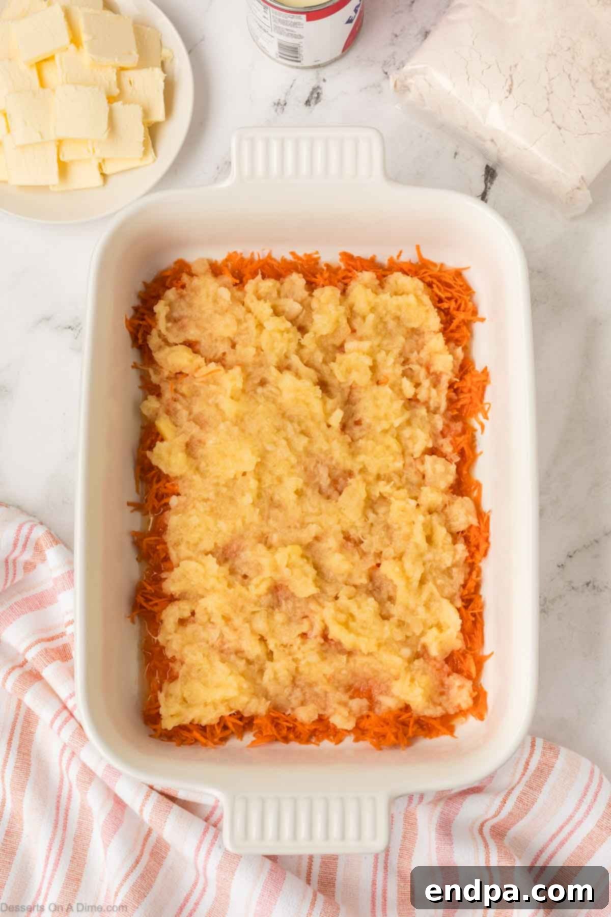 Shredded pineapple poured on top of the grated carrots.