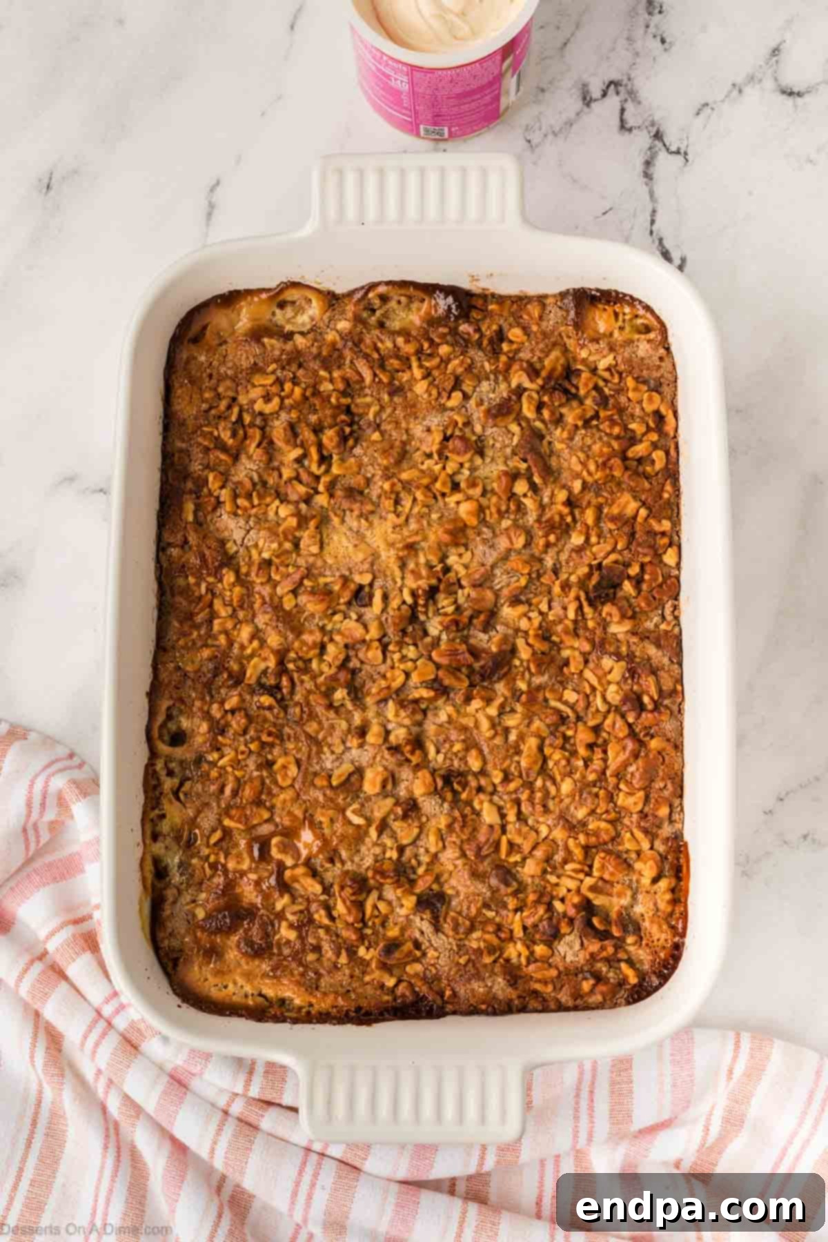 Baked cake cooling, golden brown with bubbling filling.