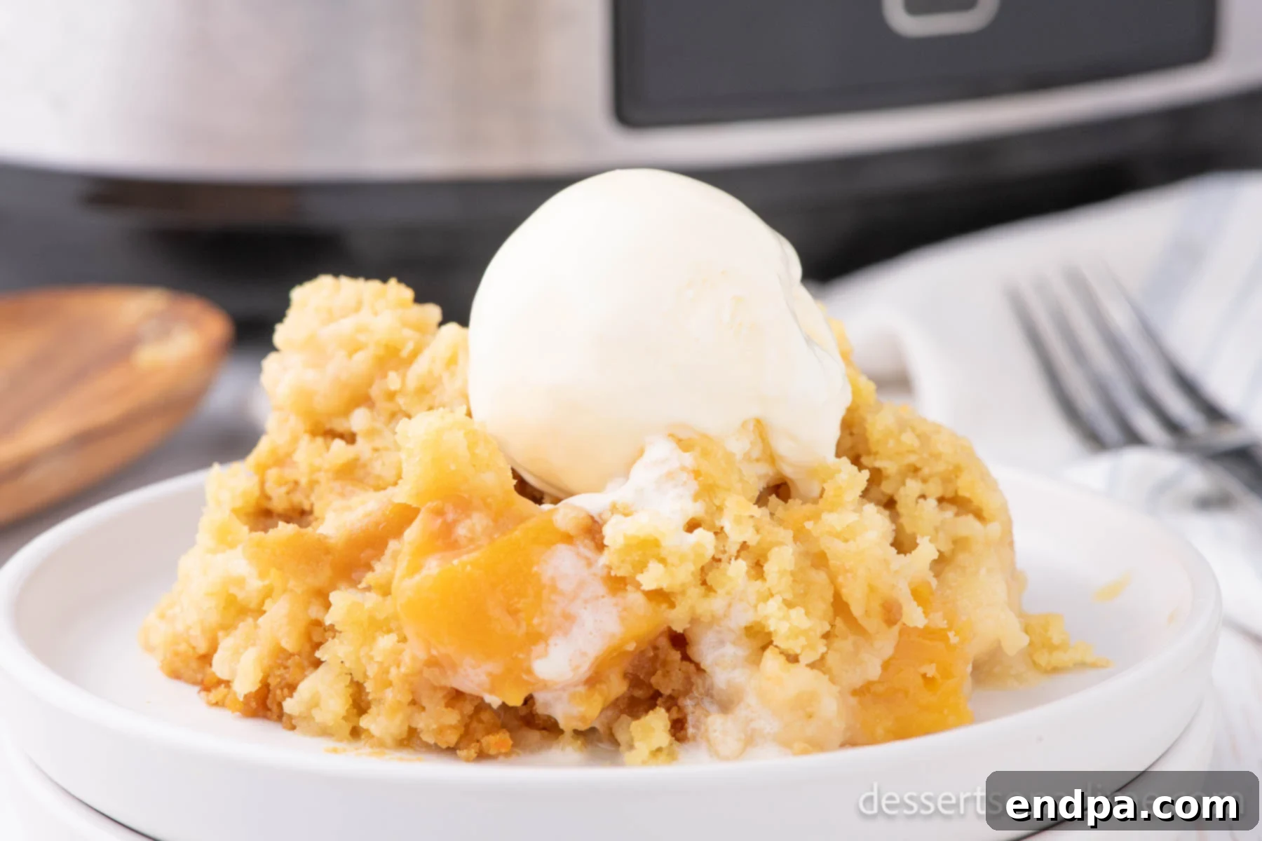 Crock pot peach dump cake with ice cream